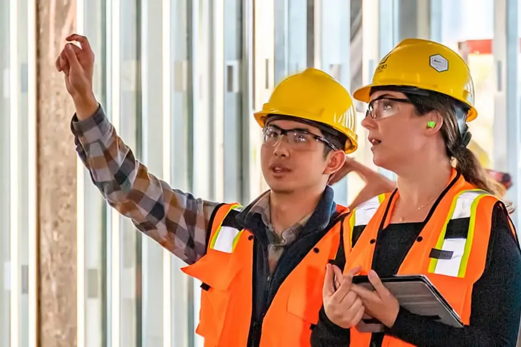 Engineer inspecting works against the approved drawing